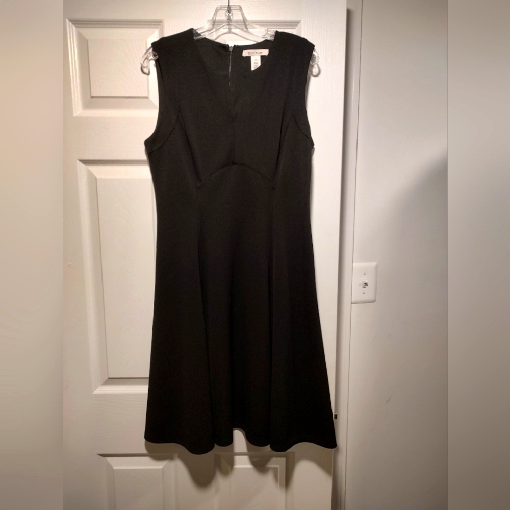 Black WHBM sleeveless dress. Notch front. Zipper back. Hardly worn.